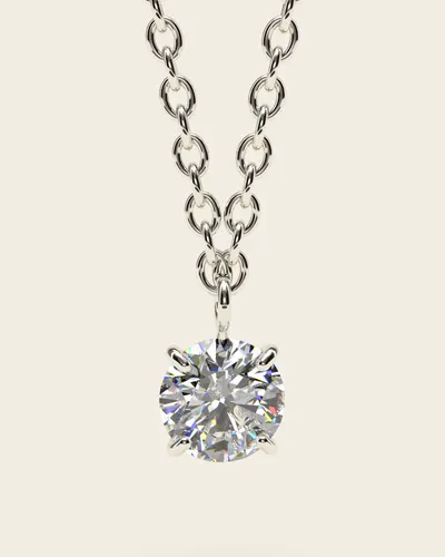 Nifada White Gold Pendant: a single clear cubic zirconia held in four fine claws, hanging from a cable chain, in 14k white gold, on an ivory background.
